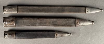 four different types of knives are lined up on a table
