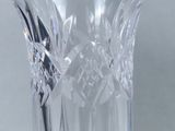 a glass vase that is sitting on a table