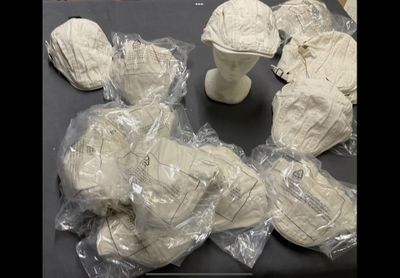 many pieces of paper wrapped in plastic bags on a table
