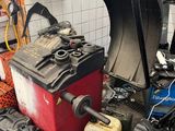 a lot of oil cans and a machine in a garage