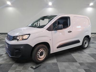 a picture of a white van parked on a checkered floor