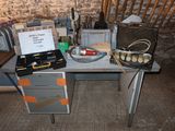 a desk with a lot of tools on it