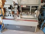 a machine that is sitting in a room with a lot of tools