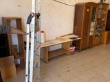 a man that is standing in a room with a ladder