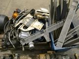 a pile of assorted metal items sitting on a pallet