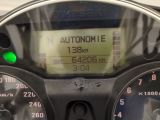 a close up of a speedometer on a motorcycle