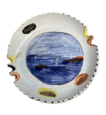 a plate with a picture of a boat in the water