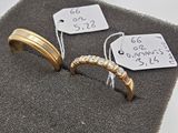 two rings and a price tag on a piece of cloth