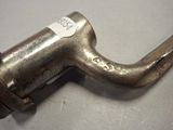 a metal pipe that is sitting on a table