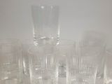 a lot of glasses that are sitting on a table