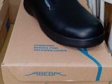 a box with a pair of black shoes on top of it