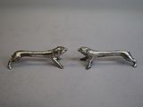 pair of silver dachshund earrings on white background