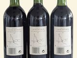 three bottles of wine sitting next to each other on a table