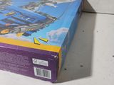 a box with a toy train on it on a table