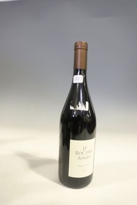 a bottle of wine that is sitting on a table