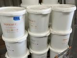 several buckets of white paint sitting on top of a wooden pallet