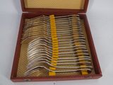 a lot of forks in a case on the table