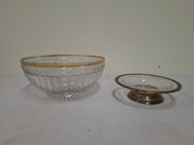 a glass bowl with a gold rim and a glass bowl with a gold rim
