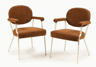 pair of orange chairs with white legs and arms on a white background