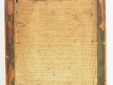 an old wooden frame with a piece of paper in it