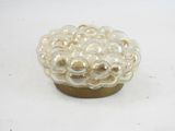 an image of a glass bowl with pearls in it