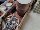 a wooden box filled with plates and bowls of silverware
