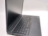 a laptop that is sitting on a white surface