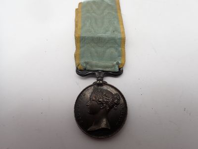 a close up of a medal with a ribbon around it