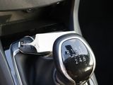 a close up of a car ' s gear lever in the center console