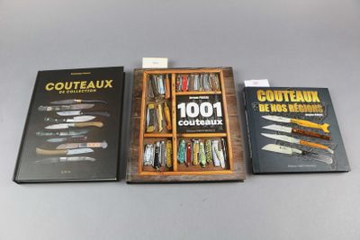 three books on a table with knives in a wooden box