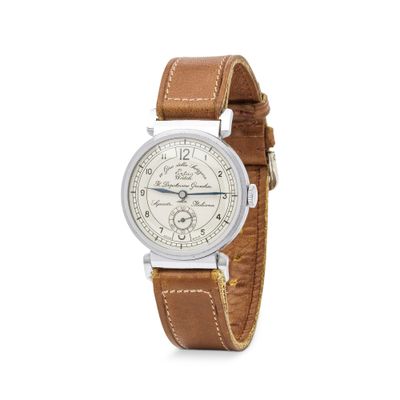 gros plan d'une montre-bracelet avec un bracelet en cuir marron