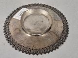 a silver plate on a table with a price tag on it