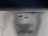 a close up view of a metal bowl with holes in it