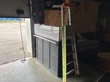 a ladder that is leaning against a wall in a garage