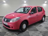 a picture of a bright pink car parked in a garage