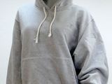 grey hoodie on a mannequin mannequin with a white background