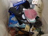 a bag full of items that are sitting on the floor
