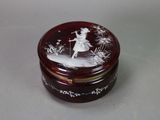 a small glass box with a picture of a woman on it