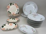 a lot of plates that are sitting on a table