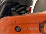 a close up of a chainsaw on the back of a motorcycle