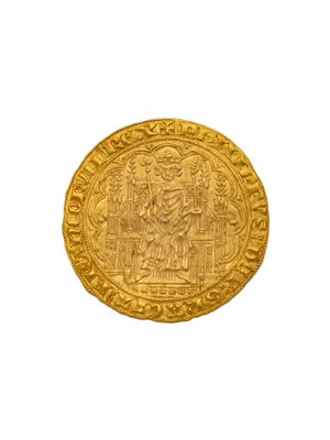 gros plan d'une pièce d'or sur fond blanc