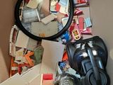 a box full of assorted items and a magnifying glass