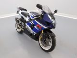 a blue and white motorcycle parked in a room