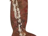 an old rusted boot hanging on a wall with a white background