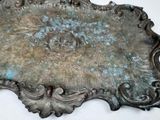 a metal plaque with a decorative design on it