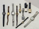 many different types of watches on a white surface