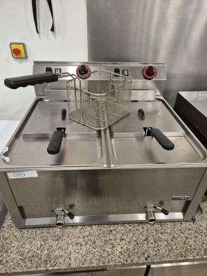 an image of a commercial deep fryer in a commercial kitchen