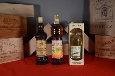 several bottles of beer are lined up on a red table