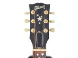 a close up of a guitar neck with a star on it
