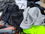 a cardboard box filled with clothing and a pair of shoes